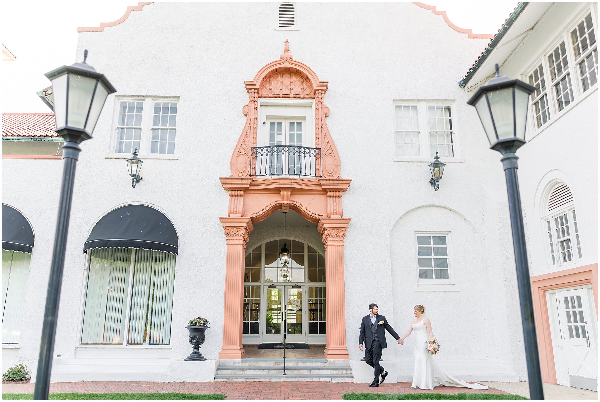 Bride and groom walking hand in hand outside historic Ravisloe Country Club in Homewood Illinois captured by Rachael Watson Photography
