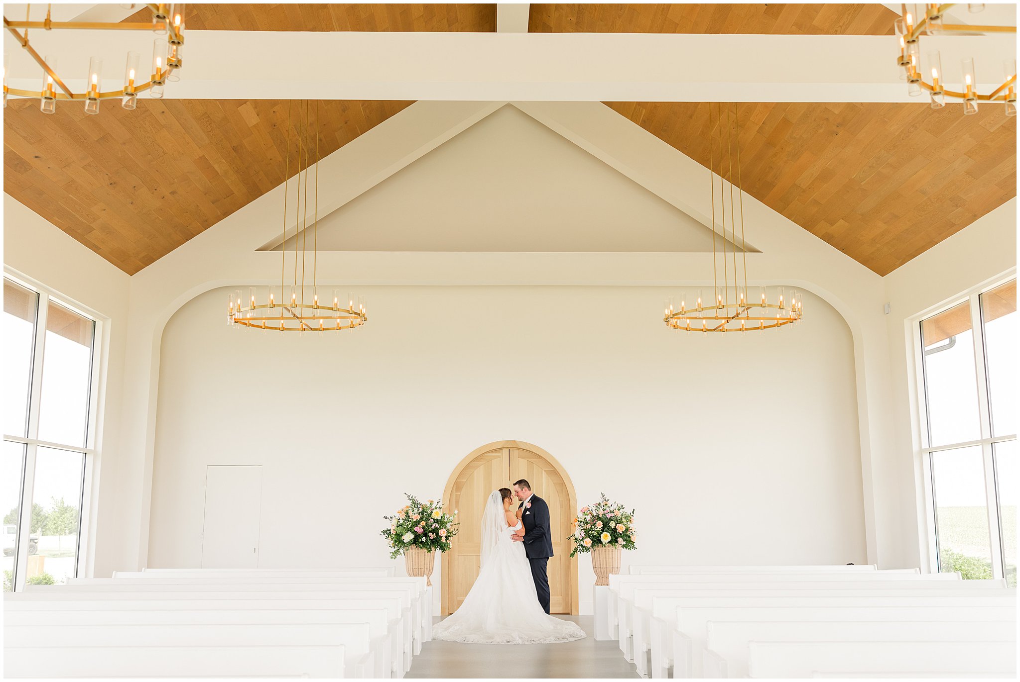 Bride & groom share a light kiss after their vows at Pear Tree Estate in Champaign, IL by Rachael Watson Photography.